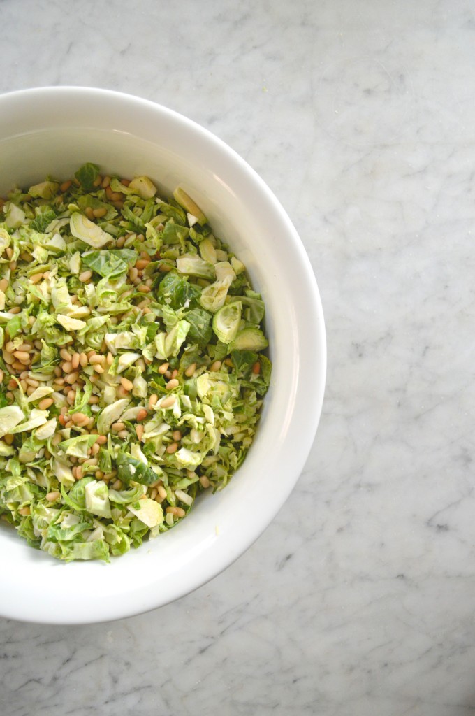 Shaved Brussel Sprout Salad with Pecorino + Pine Nuts via Simply Real Health